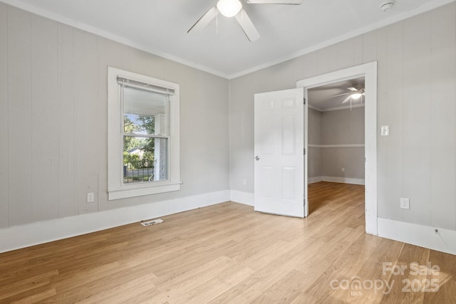 709 E Front St, Statesville, NC 28677 - spare room with ceiling fan, crown molding, light wood finished floors, and a smoke detector