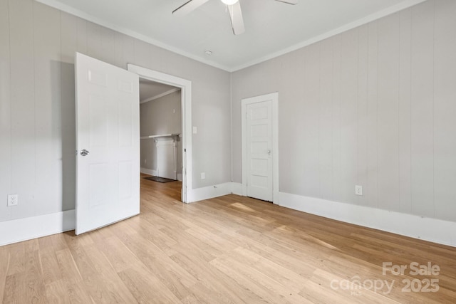 709 E Front St, Statesville, NC 28677 - spare room featuring a ceiling fan, light wood finished floors, and crown molding