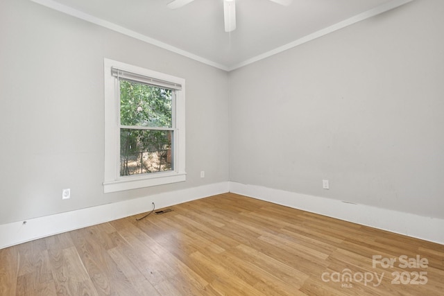 709 E Front St, Statesville, NC 28677 - unfurnished room with wood finished floors, ornamental molding, and a ceiling fan