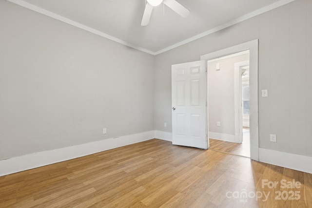 709 E Front St, Statesville, NC 28677 - spare room featuring ornamental molding, light wood-style floors, and a ceiling fan