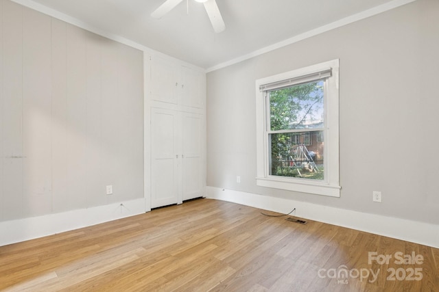 709 E Front St, Statesville, NC 28677 - spare room with wood finished floors, a ceiling fan, and ornamental molding