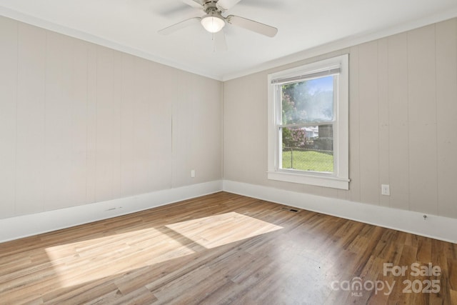 709 E Front St, Statesville, NC 28677 - unfurnished room with wood finished floors and a ceiling fan
