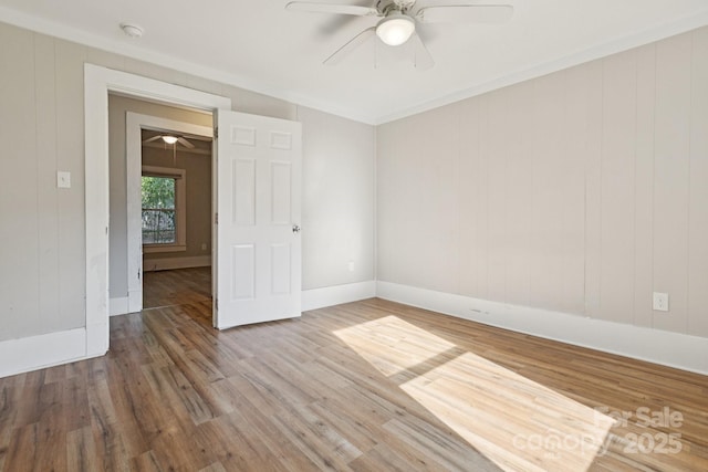 709 E Front St, Statesville, NC 28677 - spare room featuring a ceiling fan, wood finished floors, and a smoke detector