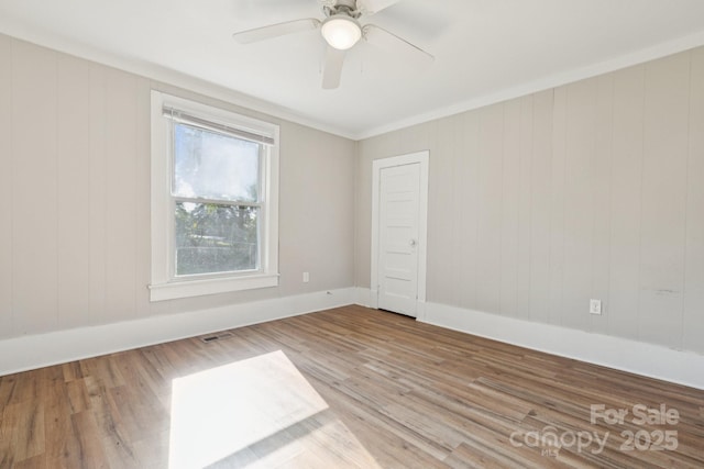 709 E Front St, Statesville, NC 28677 - spare room featuring wood finished floors, ceiling fan, and ornamental molding