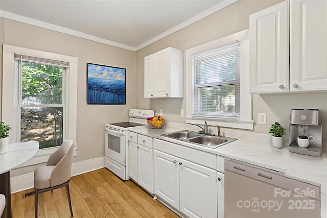 709 E Front St, Statesville, NC 28677 - kitchen featuring electric range, light countertops, white cabinetry, light wood finished floors, and ornamental molding