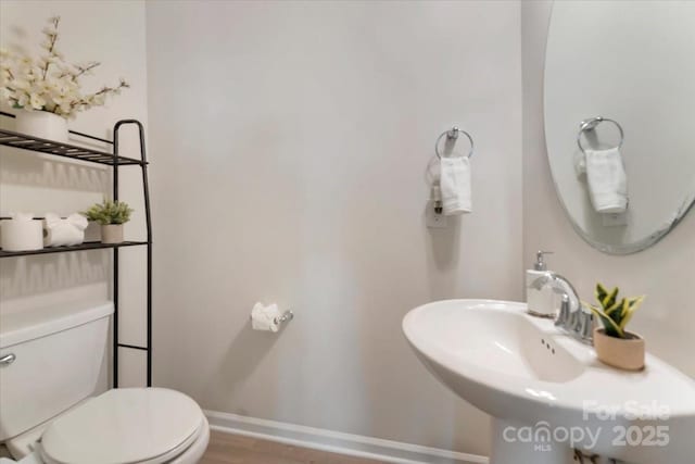 2309 Abundance Ln, Waxhaw, NC 28173 - bathroom featuring toilet and wood finished floors