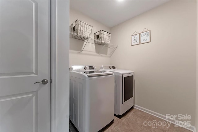 2309 Abundance Ln, Waxhaw, NC 28173 - washroom with independent washer and dryer and light tile patterned floors