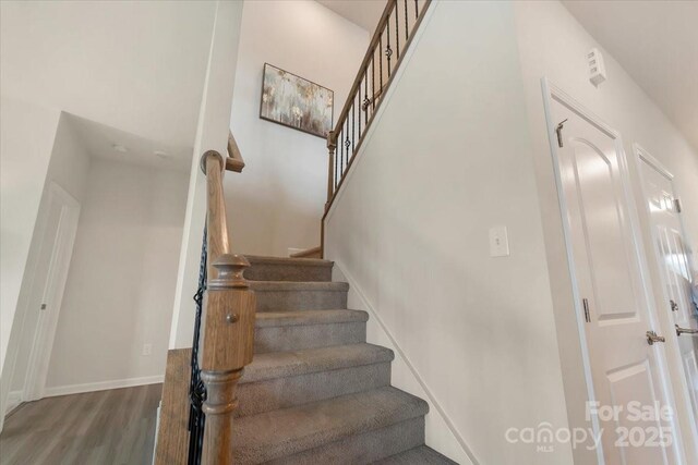 2309 Abundance Ln, Waxhaw, NC 28173 - stairway with wood finished floors and baseboards