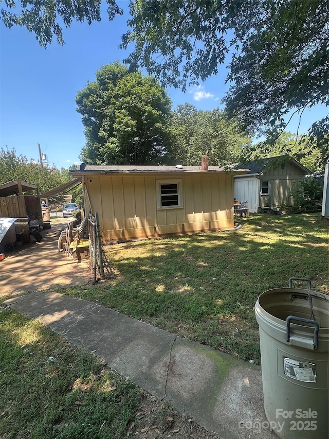 801 Tryon St, Shelby, NC 28150 - view of home's exterior featuring board and batten siding and a lawn