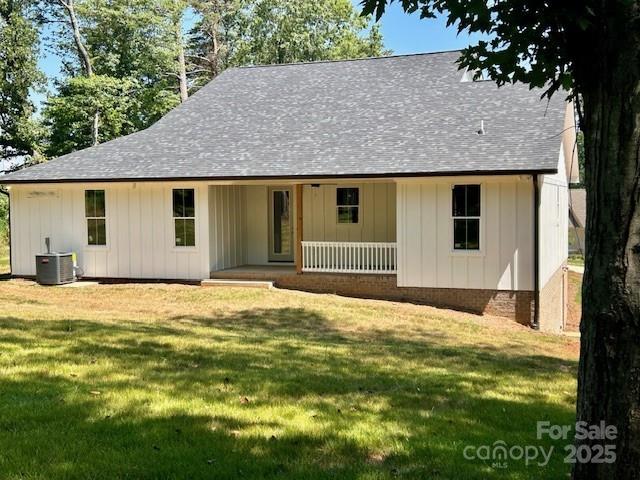 141 Maplewood Ct, Hudson, NC 28638 - view of front of property featuring a porch, board and batten siding, a front lawn, and a shingled roof