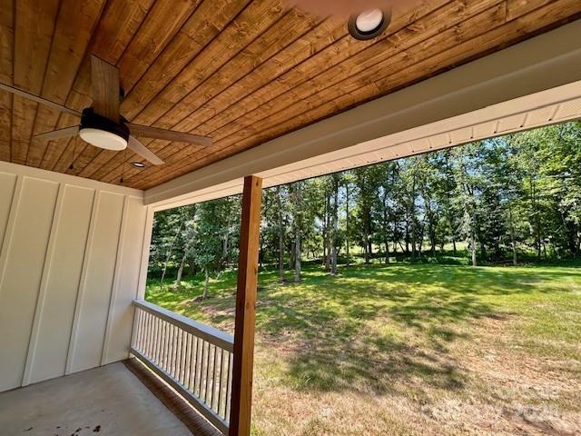 141 Maplewood Ct, Hudson, NC 28638 - view of patio featuring ceiling fan and view of wooded area