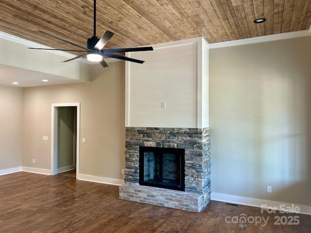 141 Maplewood Ct, Hudson, NC 28638 - unfurnished living room with wooden ceiling, a ceiling fan, ornamental molding, wood finished floors, and a stone fireplace