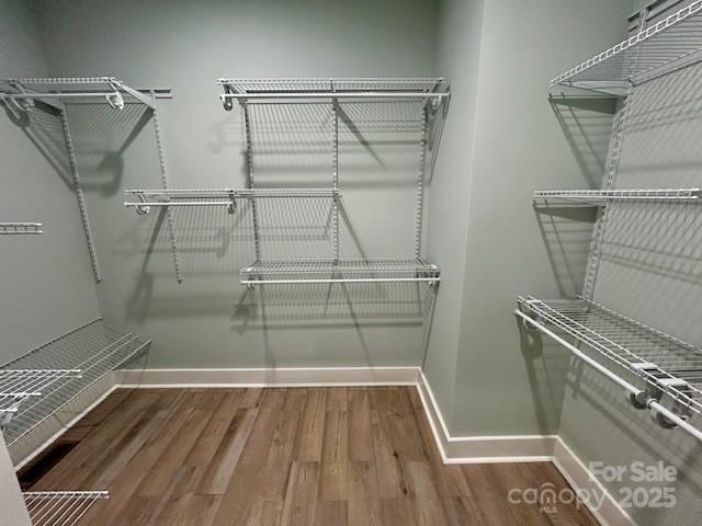 141 Maplewood Ct, Hudson, NC 28638 - walk in closet featuring wood finished floors