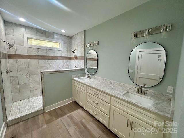 141 Maplewood Ct, Hudson, NC 28638 - full bath with a walk in shower, double vanity, and wood finished floors