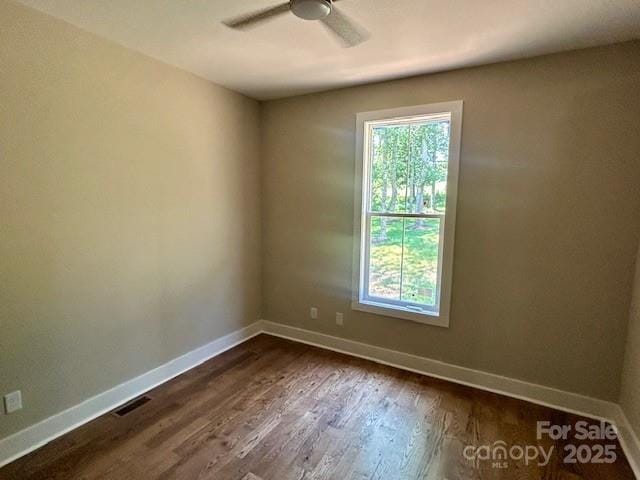 141 Maplewood Ct, Hudson, NC 28638 - unfurnished room featuring healthy amount of natural light, a ceiling fan, and dark wood-style flooring