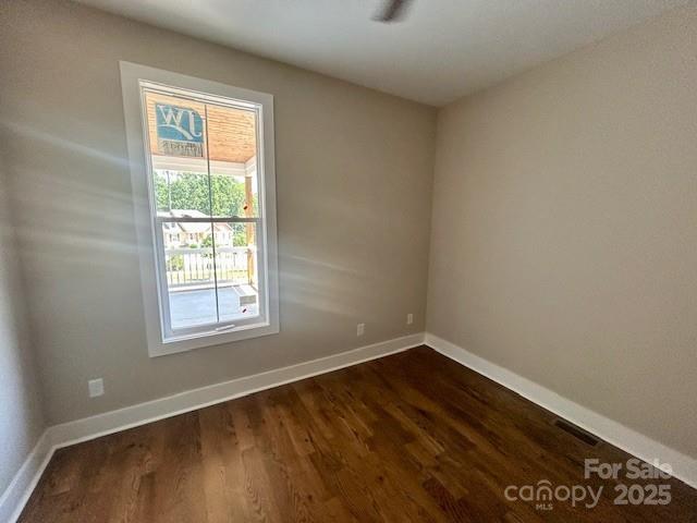 141 Maplewood Ct, Hudson, NC 28638 - spare room featuring dark wood-style flooring and baseboards
