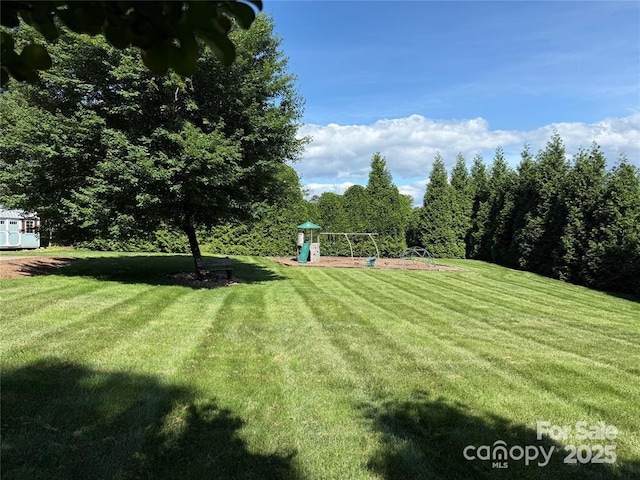 141 Maplewood Ct, Hudson, NC 28638 - view of green lawn featuring a playground