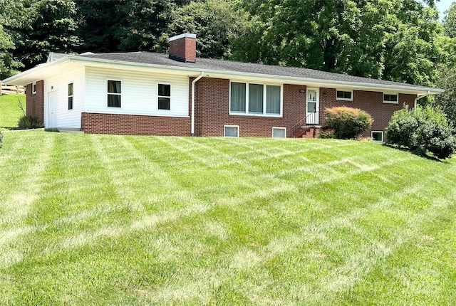 1586 Echo Dr, Lenoir, NC 28645 - back of house with entry steps, a chimney, a lawn, and brick siding