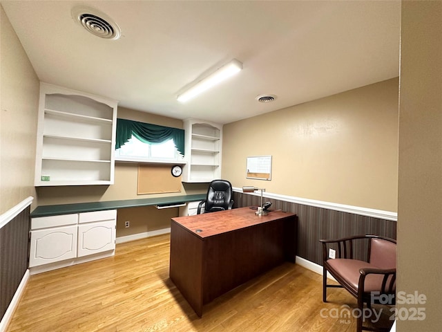 1586 Echo Dr, Lenoir, NC 28645 - office area featuring light wood-type flooring, a wainscoted wall, and built in study area