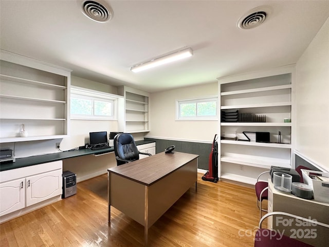 1586 Echo Dr, Lenoir, NC 28645 - office area featuring light wood-style flooring and built in desk