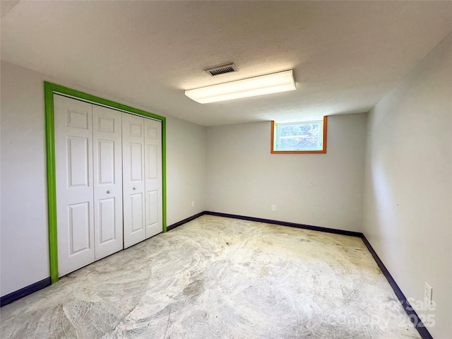 1586 Echo Dr, Lenoir, NC 28645 - unfurnished bedroom with carpet flooring, a closet, and a textured ceiling