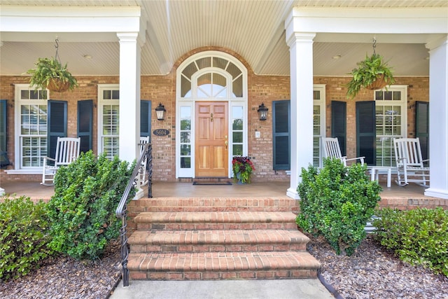 5604 Yorke St NW, Concord, NC 28027 - property entrance featuring a porch and brick siding