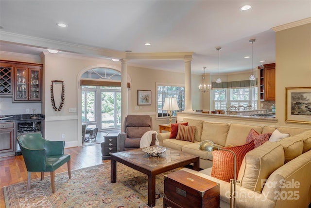 5604 Yorke St NW, Concord, NC 28027 - living area featuring ornamental molding, beverage cooler, plenty of natural light, light wood-type flooring, and a dry bar