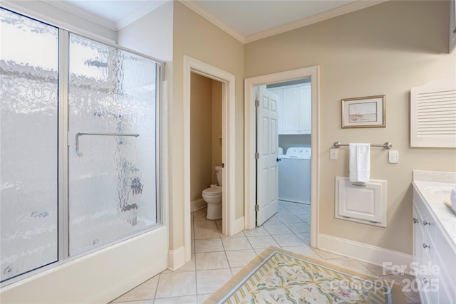 5604 Yorke St NW, Concord, NC 28027 - bathroom featuring crown molding, tile patterned flooring, vanity, shower / bath combination with glass door, and separate washer and dryer