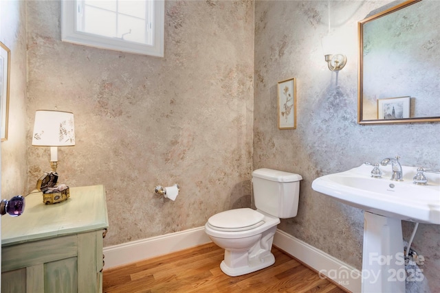 5604 Yorke St NW, Concord, NC 28027 - half bathroom featuring wood finished floors and toilet
