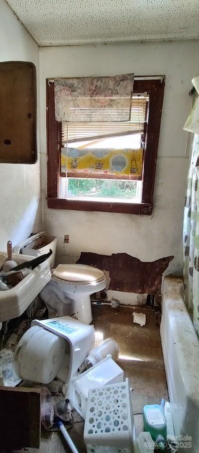 1403 Dudley Shoals Rd, Granite Falls, NC 28630 - bathroom featuring a tub and a shower with shower curtain