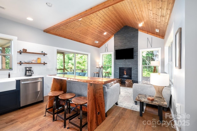 54 Weldon Way, Fairview, NC 28730 - kitchen featuring wood ceiling, stainless steel dishwasher, light countertops, a stone fireplace, and light wood-type flooring