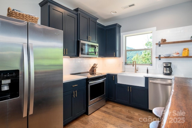 54 Weldon Way, Fairview, NC 28730 - kitchen featuring stainless steel appliances, light wood-style flooring, backsplash, light countertops, and recessed lighting