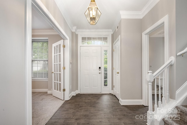 6721 Charter Hills Rd, Charlotte, NC 28277 - foyer entrance with stairs, dark wood-style flooring, ornamental molding, and a chandelier