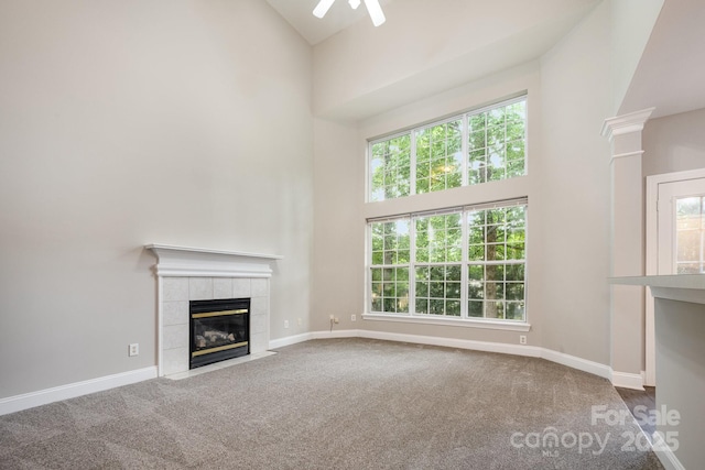 6721 Charter Hills Rd, Charlotte, NC 28277 - unfurnished living room featuring a high ceiling, carpet floors, a fireplace, and a ceiling fan