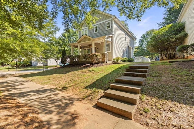 9846 Bailey Rd, Cornelius, NC 28031 - view of front of home featuring covered porch and a front lawn