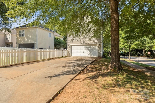 9846 Bailey Rd, Cornelius, NC 28031 - view of property exterior featuring an attached garage and driveway