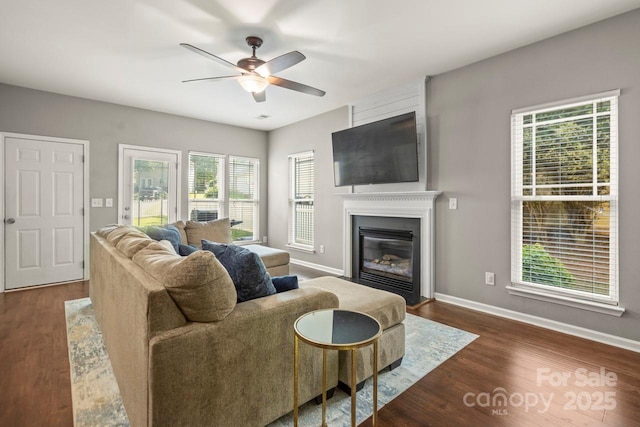 9846 Bailey Rd, Cornelius, NC 28031 - living area featuring a ceiling fan, dark wood-style floors, and a large fireplace