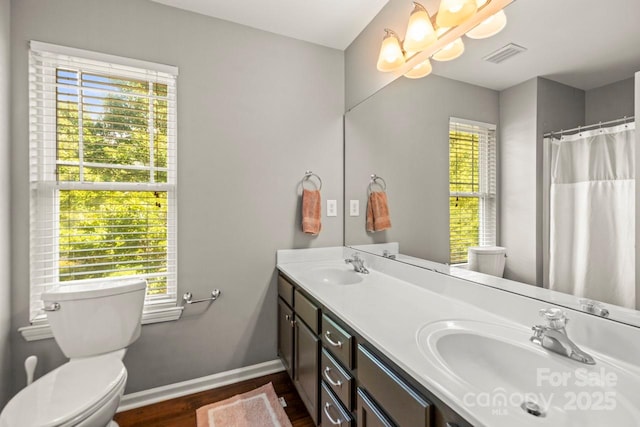 9846 Bailey Rd, Cornelius, NC 28031 - full bathroom with wood finished floors, a chandelier, and double vanity