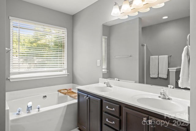 9846 Bailey Rd, Cornelius, NC 28031 - bathroom featuring double vanity and a garden tub