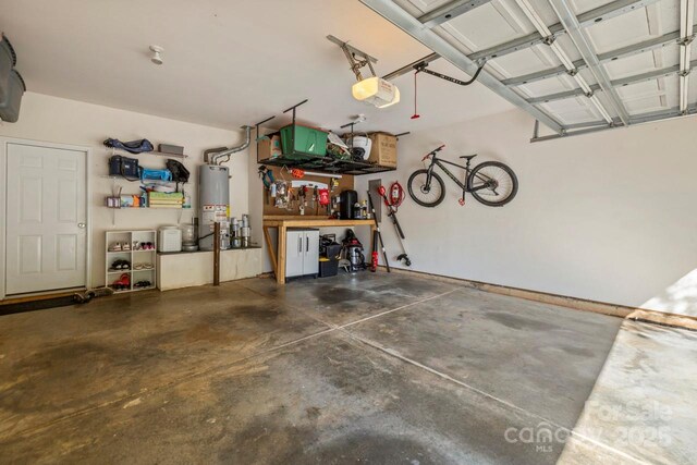 9846 Bailey Rd, Cornelius, NC 28031 - garage with gas water heater, a workshop area, and a garage door opener