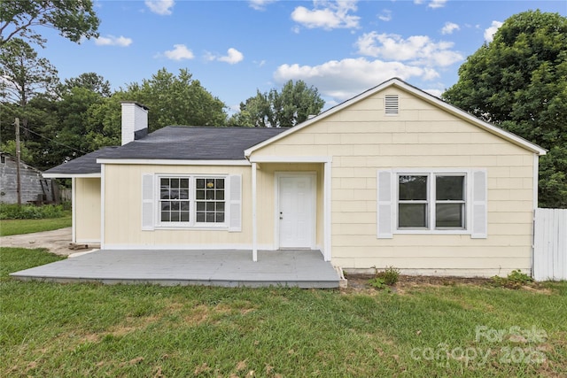 1208 Arch St E Unit 10, Lancaster, SC 29720 - bungalow featuring a front yard, a chimney, and a shingled roof