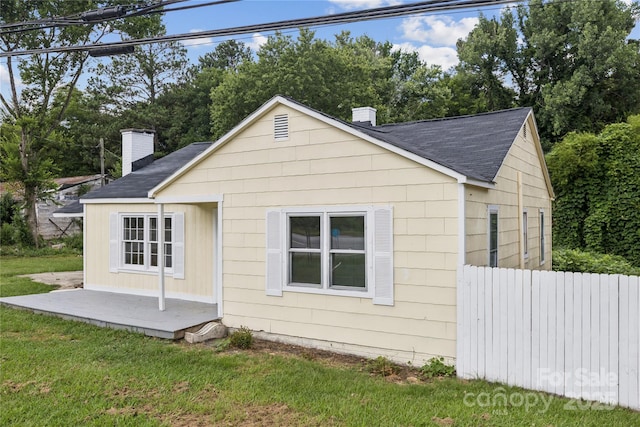 1208 Arch St E Unit 10, Lancaster, SC 29720 - view of side of property with a chimney and roof with shingles