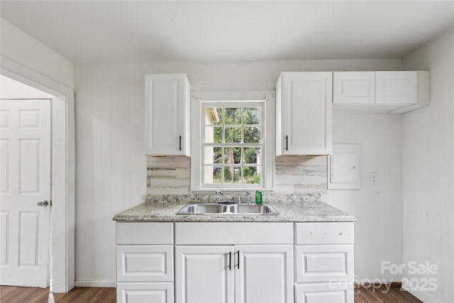 1208 Arch St E Unit 10, Lancaster, SC 29720 - kitchen featuring dark wood-style flooring, white cabinets, light countertops, and tasteful backsplash