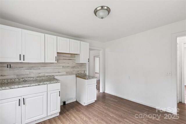 1208 Arch St E Unit 10, Lancaster, SC 29720 - kitchen featuring white cabinetry, light wood-type flooring, and tasteful backsplash