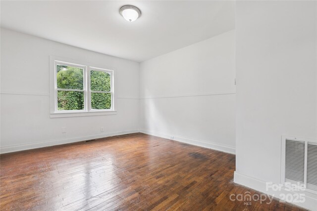 1208 Arch St E Unit 10, Lancaster, SC 29720 - spare room featuring hardwood / wood-style flooring and baseboards