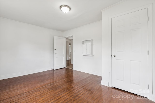 1208 Arch St E Unit 10, Lancaster, SC 29720 - spare room with dark wood-style flooring and ornamental molding