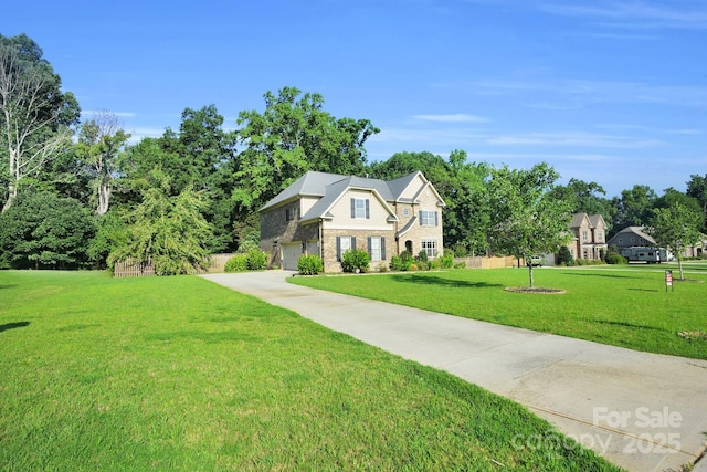 12515 Hashanli Pl, Matthews, NC 28105 - view of front facade featuring a front yard, stone siding, driveway, and a garage