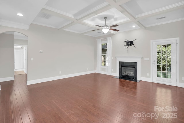 12515 Hashanli Pl, Matthews, NC 28105 - unfurnished living room featuring arched walkways, a glass covered fireplace, dark wood-type flooring, a ceiling fan, and beam ceiling