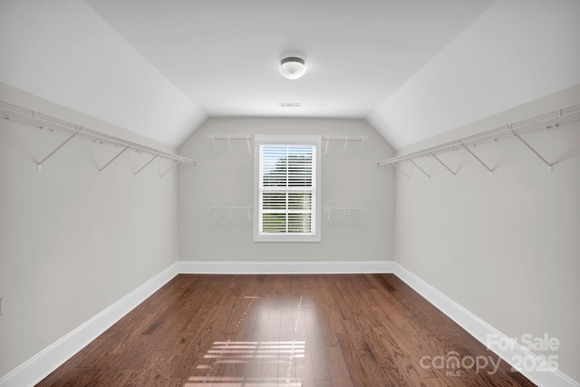 12515 Hashanli Pl, Matthews, NC 28105 - spacious closet featuring dark wood-style flooring and lofted ceiling