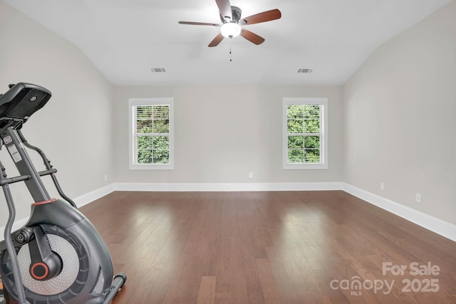 12515 Hashanli Pl, Matthews, NC 28105 - exercise area featuring lofted ceiling, healthy amount of natural light, ceiling fan, and dark wood-style floors